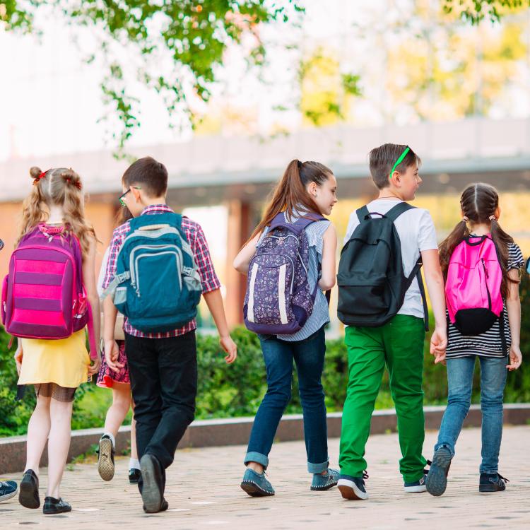  Kids at school wearing backpacks