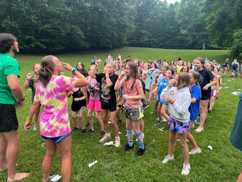 youth playing game of follow the leader at camp